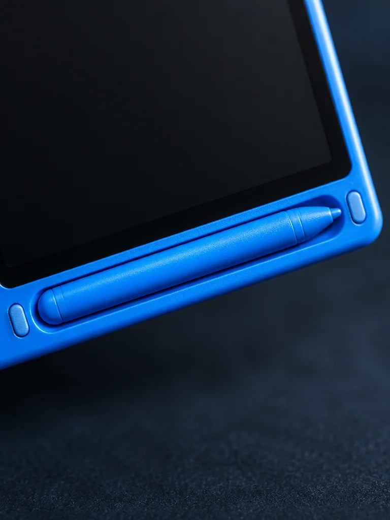A tight macro view along the lower edge of the exact blue LCD tablet from the reference, focusing on